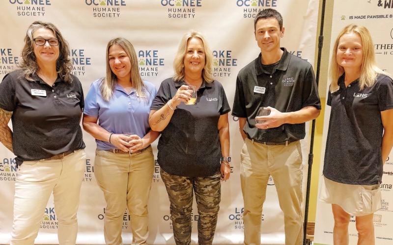 Executive Director of the Lake Oconee Humane Society Diane Robertson, with staff members Kaly Cave-Bigley and Tammy Ellis, LOHS veterinarian Dr. Andrew Duncan, and Molly Rowland. LEIGH LOFGREN/Staff
