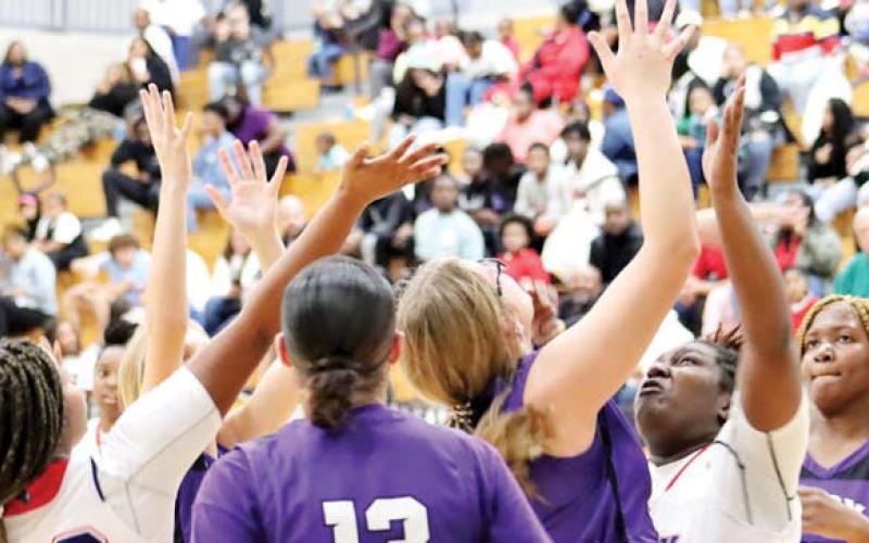 Senior Breanna Nelson (35) tries to pull down a rebound over a couple of Jasper County players. ARELLA CASH/Staff
