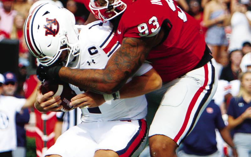 Georgia defensive lineman Tyrion Ingram-Dawkins (93) sacked Auburn quarterback Payton Thorne twice in Saturday’s win over the Tigers. LANCE McCURLEY/Staff