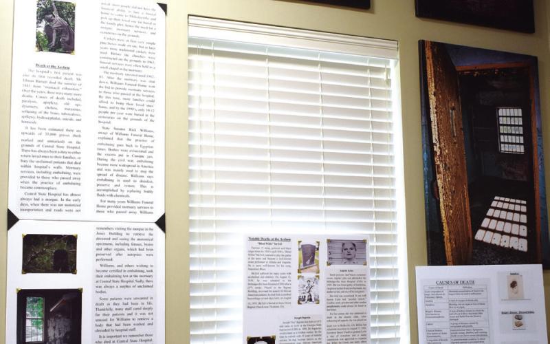 The Death at the Asylum exhibit hosts pictures, informational boards and artifacts. BAILEY MCCULLY/Staff