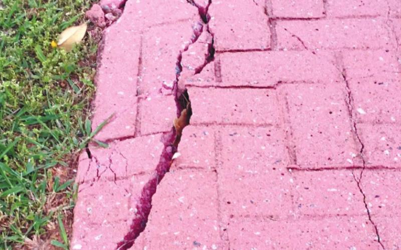 The Eatonton City Council voted to seek a state grant to repair other sidewalks in downtown Eatonton. MARK ENGEL/ S t a ff