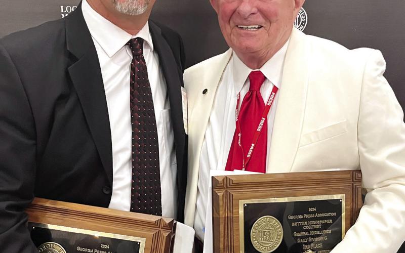 Smith Communications President and CEO A. Mark Smith Sr. (right) with General Manager Matt Smith attended the annual Georgia Press Association convention at Jekyll Island last week. CONTRIBUTED