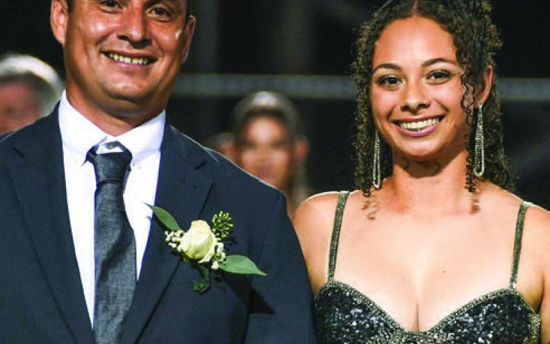 Kimberly Michelle Mendez escorted by her father Tito Mendez. IAN TOCHER/Staff
