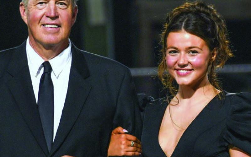 Audrey Cate Hicks escorted by her father Rus Hicks. IAN TOCHER/Staff