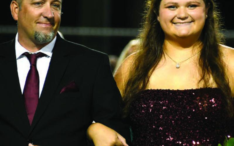 Madison Reese LaVigne escorted by her father Josh LaVigne. IAN TOCHER/Staff