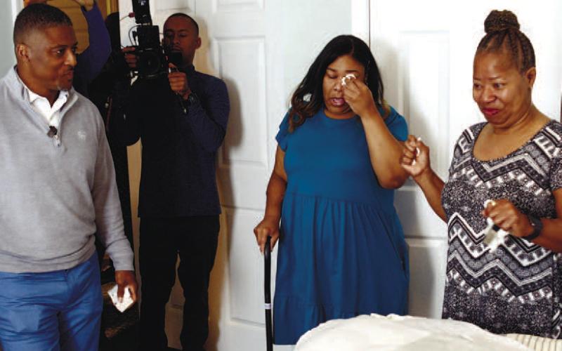 A full TV production crew followed Warrick Dunn, new homeowner Mary, and her daughter Britannica, as they toured their new Habitat for Humanity-built home in Eatonton.