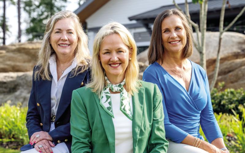 Traci Johnson (center) named Sales Executive of the Month for July 2026, is joined by Monthly Sales Leaders Mary Luster and Debbie Daly. CONTRIBUTED