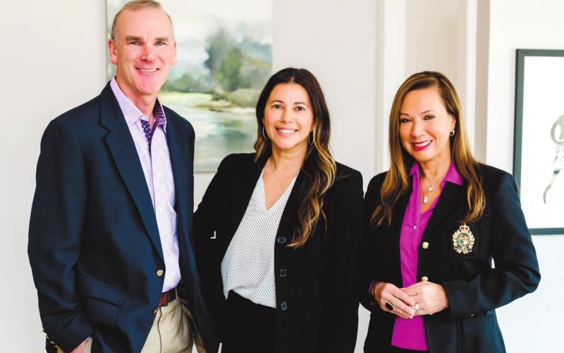 Ted and Riezl Baker welcome Charlotte Hildreth (center) to the Luxury Lake Oconee real estate sales team. CONTRIBUTED