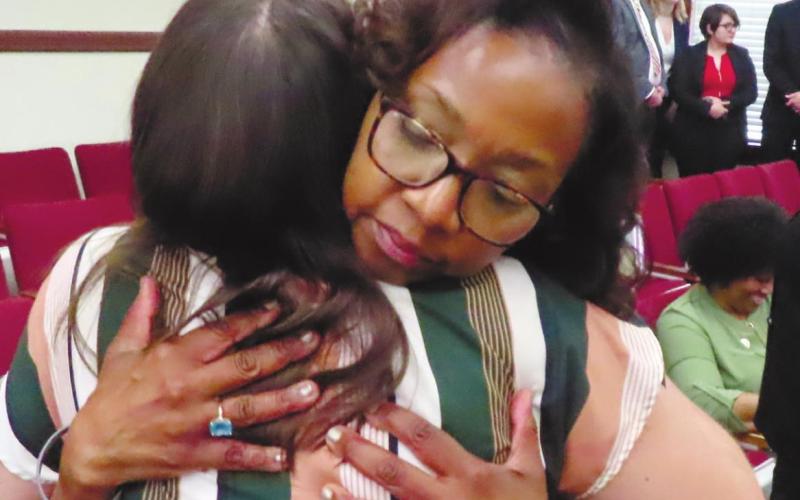 Denise Billue, sister of murder victim Sgt. Curtis Billue, hugs Putnam County Victim’s Advocate Kristen Dupree after the sentencing. COURT POOL COVERAGE