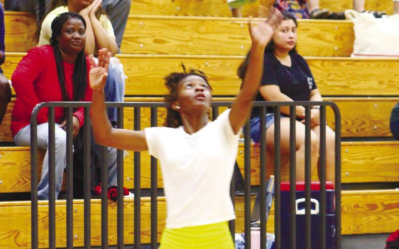 Freshman JV player Brysen Pearson prepares to serve the ball. ARELLA CASH/Staff