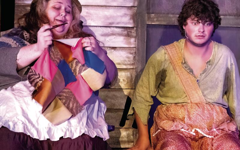 Huck (Tyler Stella) meets a strange woman outside her shanty.