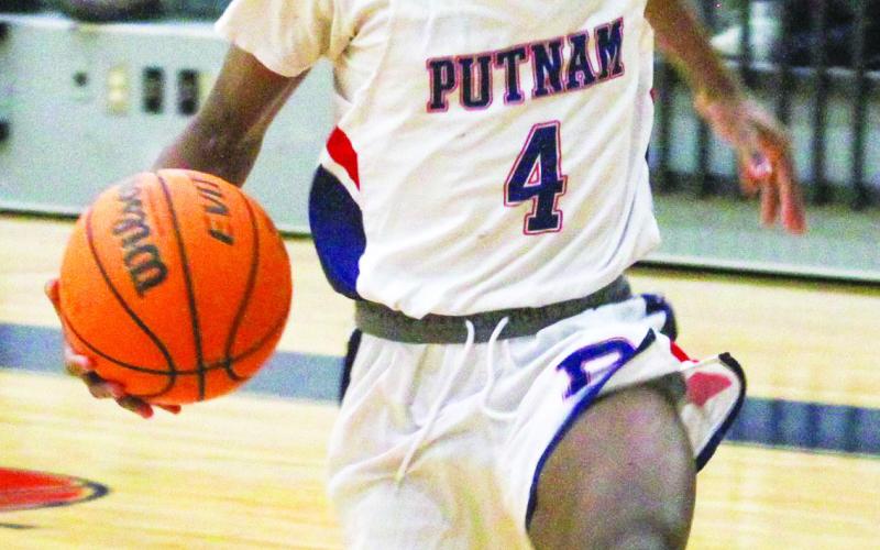 Putnam County sophomore Jaylen Nelson goes up for a layup in a win over Jones County. He had seven points against the Greyhounds. BRAD HARRISON/Staff