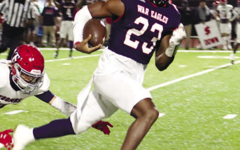 Jalon Kilgore (23) breaks off on a long scoring run against the Bulldogs this past Friday. ARELLA CASH/Staff