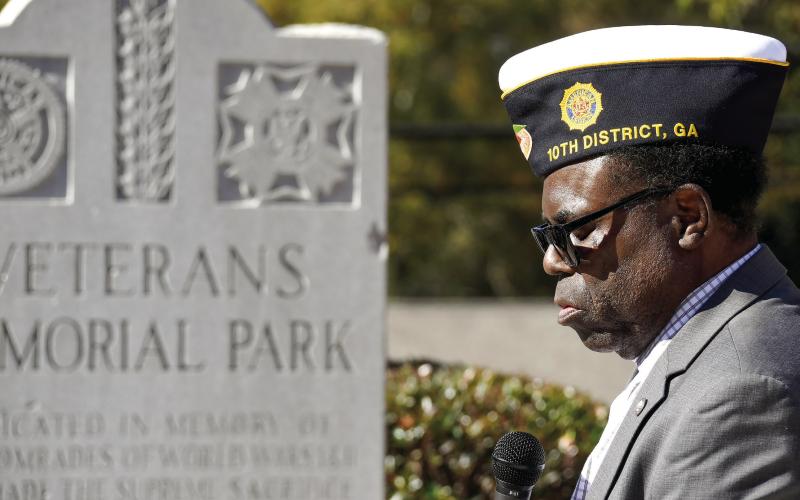 Reverend Sidney Jackson, a veteran himself, gave the invocation before the annual Veterans Day ceremony on Tuesday at the Putnam County Veterans Roll of Honor Park in Eatonton. IAN TOCHER/Staff