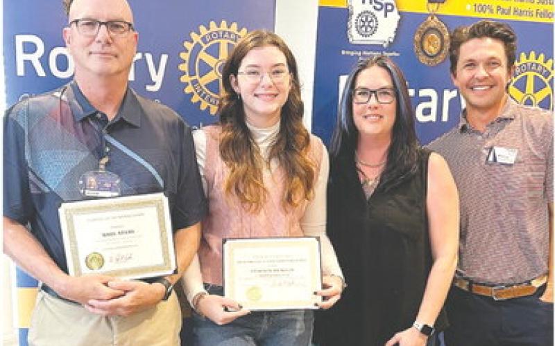 Mark Adams, Samantha Spisak, Ashley Spisak, and Rotarian Dr. Tyler Franks pose together. CONTRIBUTED