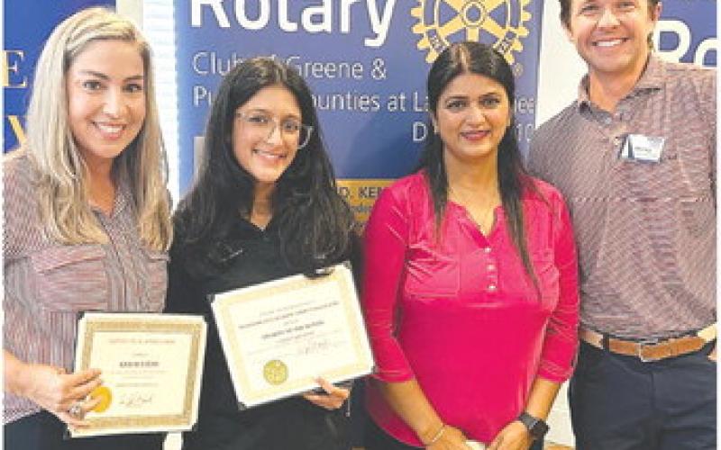 Kris Stevens, Keerti Ahluwalia, Mona Ahluwalia, and Rotarian Dr. Tyler Franks pose together. CONTRIBUTED