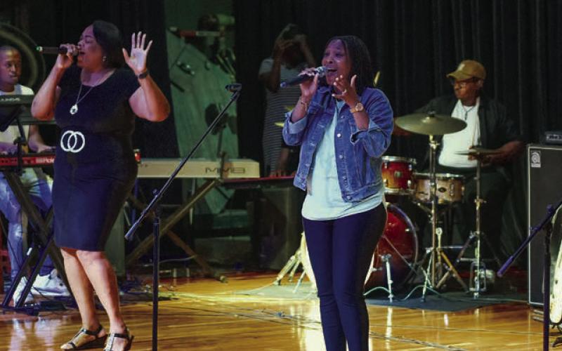 Each vocalist for the show opening God of Mercy Praise Team took turns as lead singer on Saturday night.  IAN TOCHER/Staff