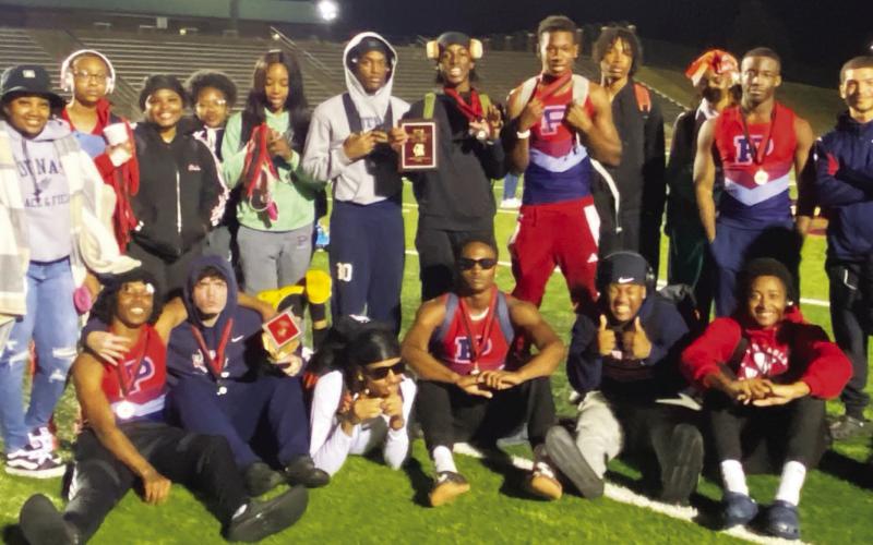 Members of both Putnam County track and field teams pose for a photo after a successful meet at Baldwin High School earlier this month. CONTRIBUTED
