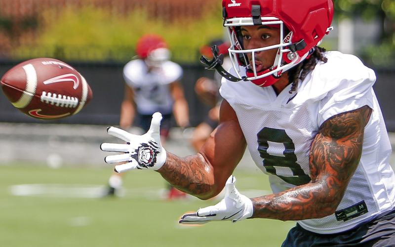 Georgia veteran defensive back Joenel Aguero prepares to catch a pass while participating in position drills during a practice on Thursday, July 31. LANCE McCURLEY/Staff
