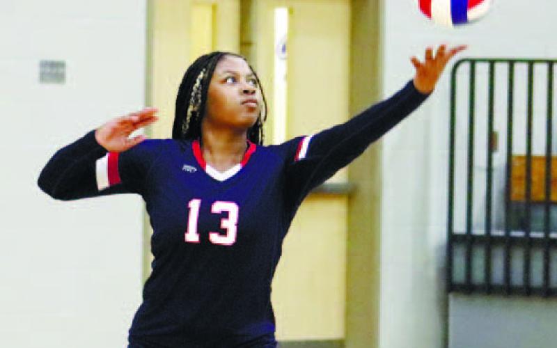 Tytianna Little (No. 13) gets set to serve. ARELLA CASH/Staff