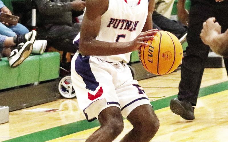 Putnam County senior guard Jaylin Harper (5) will play a key role as the team’s leader this year. LANCE McCURLEY/Staff