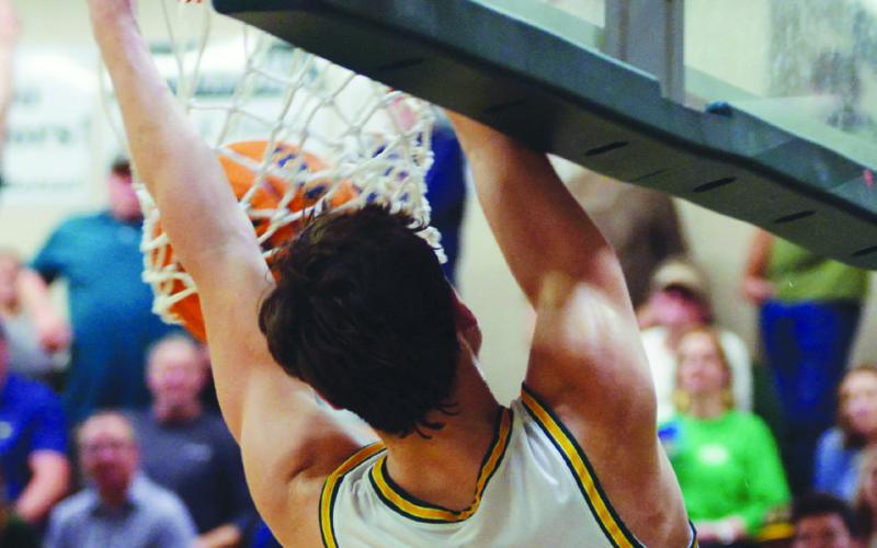 Gatewood’s Matt Allen completes a dunk in crowdpleasing fashion Friday night in Eatonton. IAN TOCHER/Staff