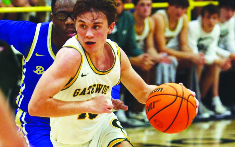 Gatewood senior Kaden Keiser drives hard to the net with a Brentwood player in hot pursuit. IAN TOCHER/Staff