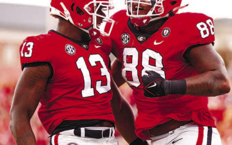 Georgia defensive linemen Mykel Williams (13) and Jalen Carter (88) celebrate during the win against Tennessee. (TONY WALSH/UGA Athletics)