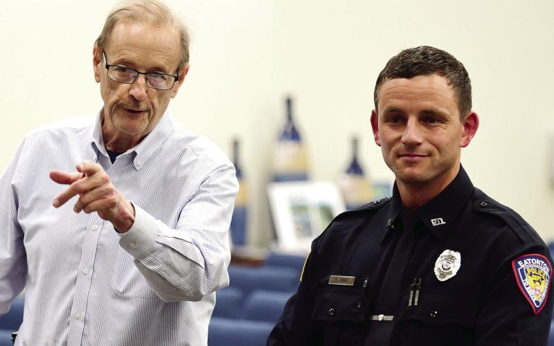 Eatonton Police Chief Howell Cardwell (left) introduced Officer Matthew Shiver to the council, emphasizing how well Shiver did in his 16-week, staterun police academy training. IAN TOCHER/Staff