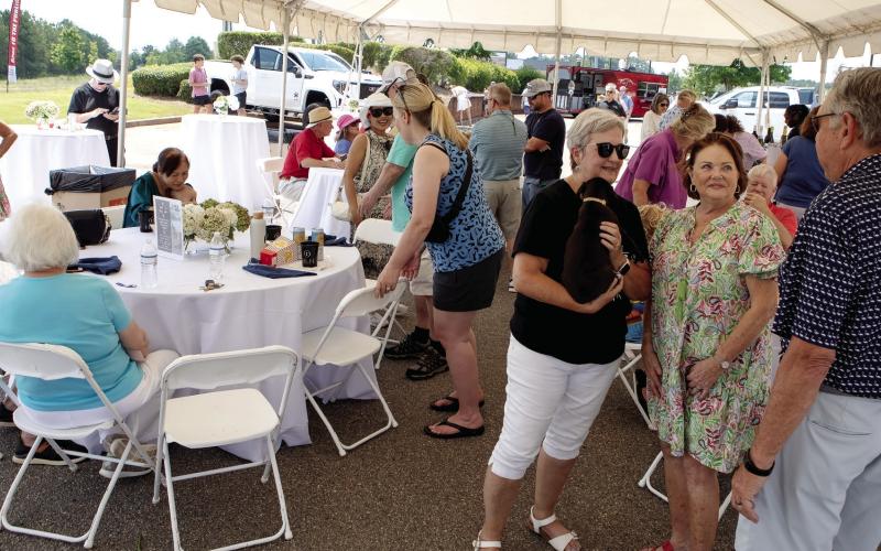 A large, open-sided tent provided much-needed shade and a place to sit down during the Lake Oconee Humane Society benefit event. (LEIGH LOFREN/Staff)