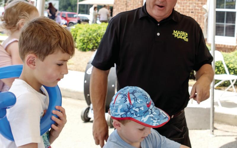 Mark the Magic Man was up to his usual tricks with Calloway and Carter White. (LEIGH LOFREN/Staff)
