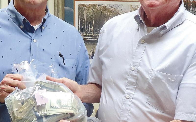 Eatonton Police Chief Howell Cardwell, left, and Putnam County Sheriff’s Lt. Harry Luke show part of the evidence they seized in a joint-operation large drug case.