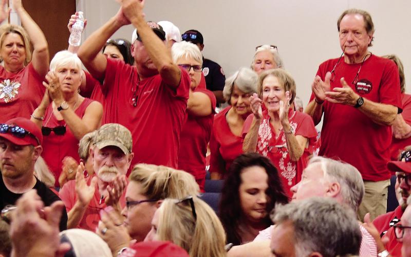 The Putnam County audience, with the majority dressed in red, was overwhelmingly supportive of speakers who opposed the quarry application. IAN TOCHER/Staff
