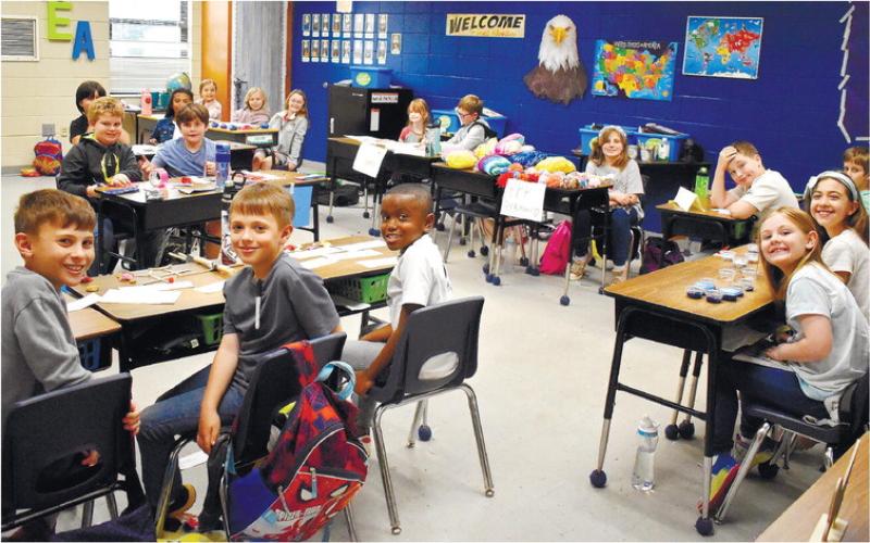 Third-grade business owners are ready for the customers in Dr. Rita Thomas’ classroom.