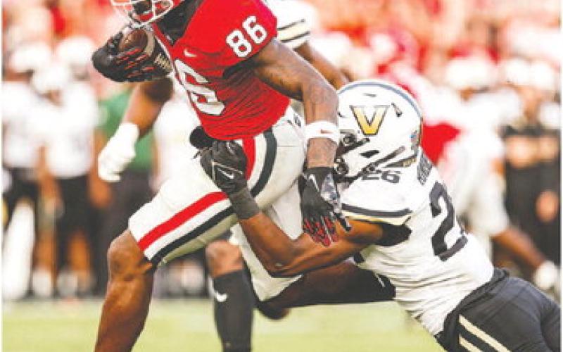 Freshman wide receiver Dillon Bell (86) runs in a touchdown pass from quarterback Carson Beck on his way to five total receptions for 54 yards. TONY WALSH/UGA Athletics