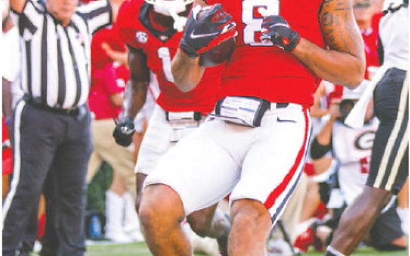 Georgia wide receiver Dominick Blaylock (8) scores his first touchdown since recovering from two knee surgeries. TONY WALSH/UGA Athletics