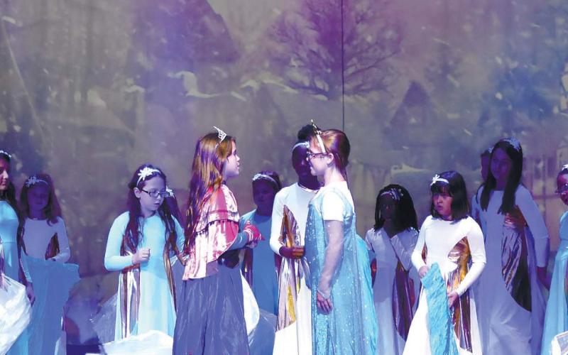 Anna and Elsa face each other in the scene named “Love Will Thaw” as Hans (Jordan Little) is motionless on the floor after his plot to marry Anna to usurp the throne was uncovered. LENA HENSLEY/Staff