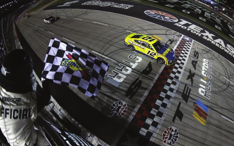 Ryan Blaney, driver of the #12 Menards/Wrangler Ford, takes the checkered flag to win the Cup Series All-Star Race at Texas Motor Speedway Sunday. (Sean Gardner/Getty Images)