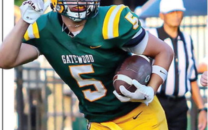 Gatewood running back Brady Haley runs downfield behind his blockers during a scrimmage against Edmund Burke Academy on July 31. TREY NORRIS/Staff