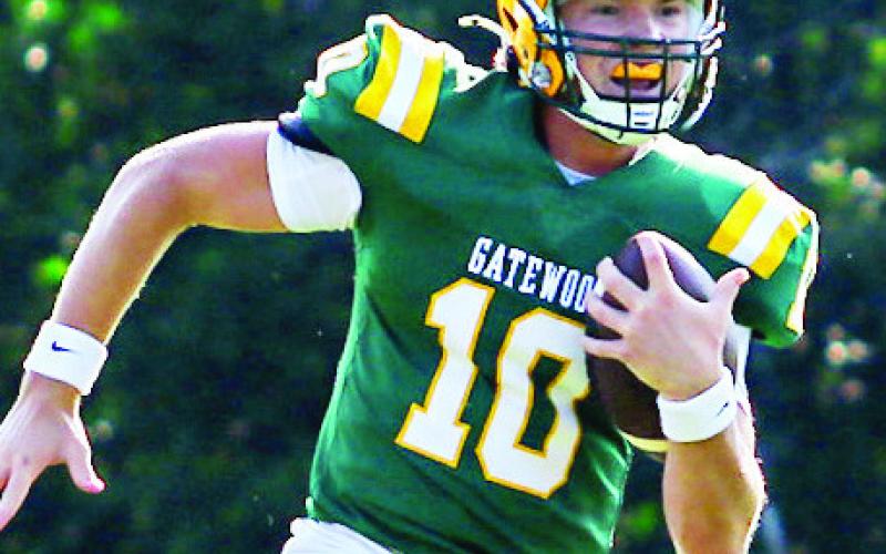 Gatewood quarterback Blake Brannen scrambles out of the pocket for a first down against Edmund Burke. TREY NORRIS/Staff