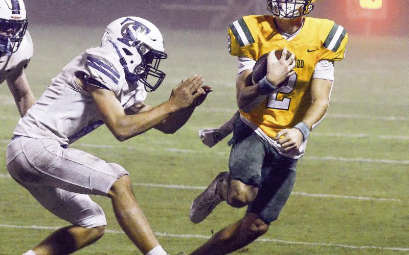Ben Brannen (2) evades a Trinity Christian defender. IAN TOCHER/Staff