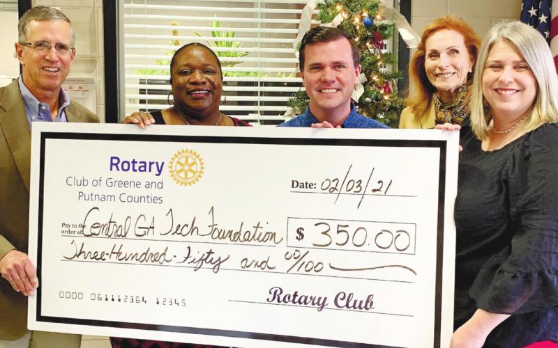 The Rotary Club of Greene and Putnam counties presents a check to the Putnam County Campus of Central Georgia Technical College. CONTRIBUTED