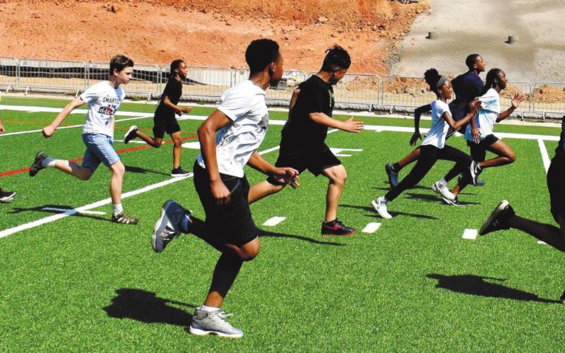 Campers compete among each other in running a short-distance race. LENA HENSLEY/Staff