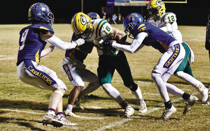 Dylan Sinclair (18) tries to break free from a couple of defenders. CONTRIBUTED/Dawn Sinclair