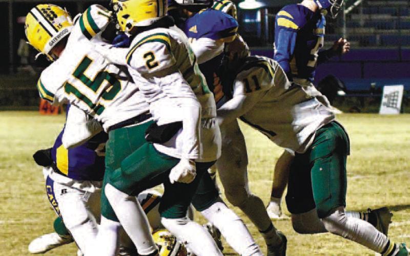 Lawson Wooien (15) and a couple of other Gator defenders bring down Augusta Prep player. CONTRIBUTED/Dawn Sinclair