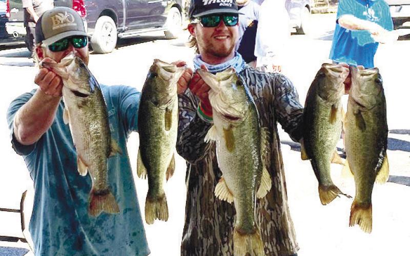 First-place winners Matthew Foster and Mitchell Dean show off their winning fish that weighed in at 18.74 pounds in total. CONTRIBUTED