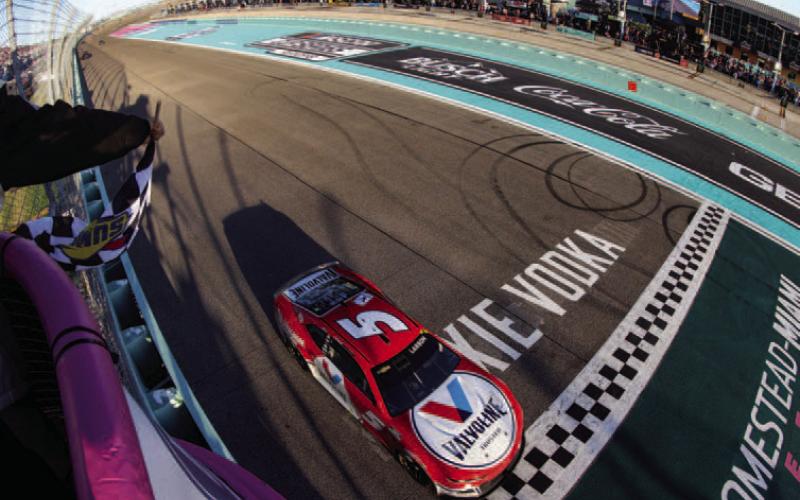 Kyle Larson, driver of the #5 Valvoline Chevrolet, takes the checkered flag to win the Cup Series Dixie Vodka 400 at Homestead-Miami Speedway Sunday. (Jared East/Getty Images)