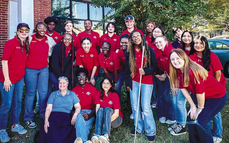 Members of the PCHS Service Leadership class pose with teacher Ravi Hudson (holding cane), who encouraged them to interact with students at the Georgia Academy for the Blind for the benefit of both groups. CONTRIBUTED