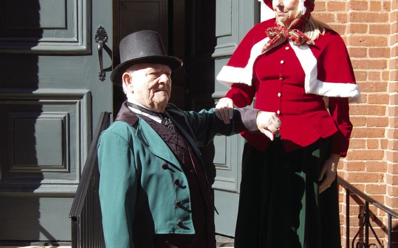 With both sporting periodcorrect attire, Rev. Meg Jackson Clark is assisted down the church steps by Spencer Hinds. CONTRIBUTED