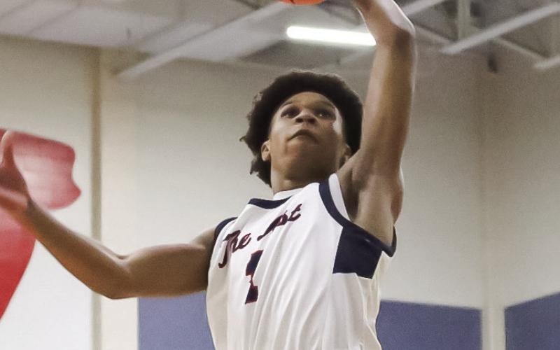 Putnam County senior guard Jeremy Banks goes up for a dunk during a game last season. Banks will take on a larger leadership role for the War Eagles this season as they look to build on last year’s run to the GHSA Class 2A Elite Eight. TREY NORRIS/Staff